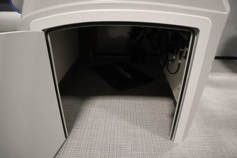 Slide: The Image of Open storage compartment in 2025 Bentley Pontoons 223 Bolt Tri-Toon boat. - 14