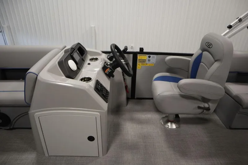 Slide: The Image of 2025 Bentley Pontoons 223 Bolt Tri-Toon interior with steering console and captain's chair. - 18