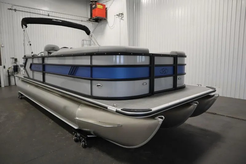 Slide: The Image of 2025 Bentley Pontoons 223 Bolt Tri-Toon in a showroom, showcasing sleek design and modern features. - 2