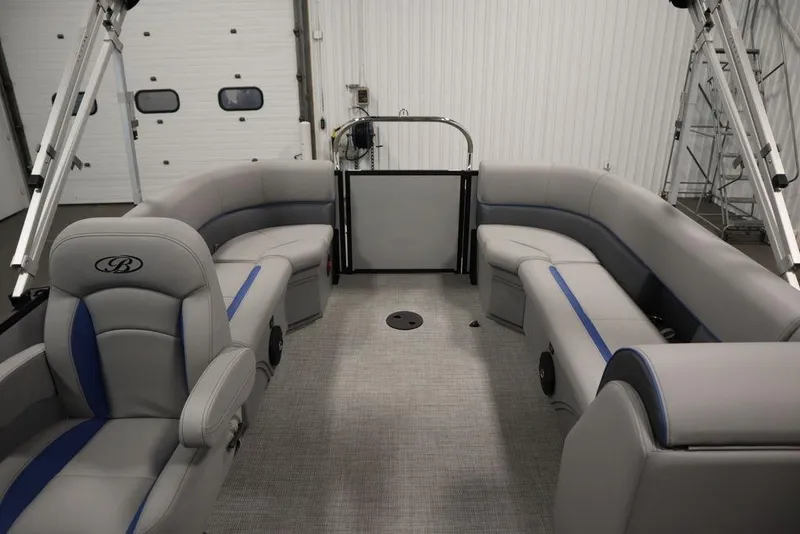 Slide: The Image of 2025 Bentley Pontoons 223 Bolt Tri-Toon interior with gray seating and blue accents. - 29