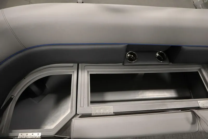 Slide: The Image of 2025 Bentley Pontoons 223 Bolt Tri-Toon interior storage compartment with cup holders. - 30