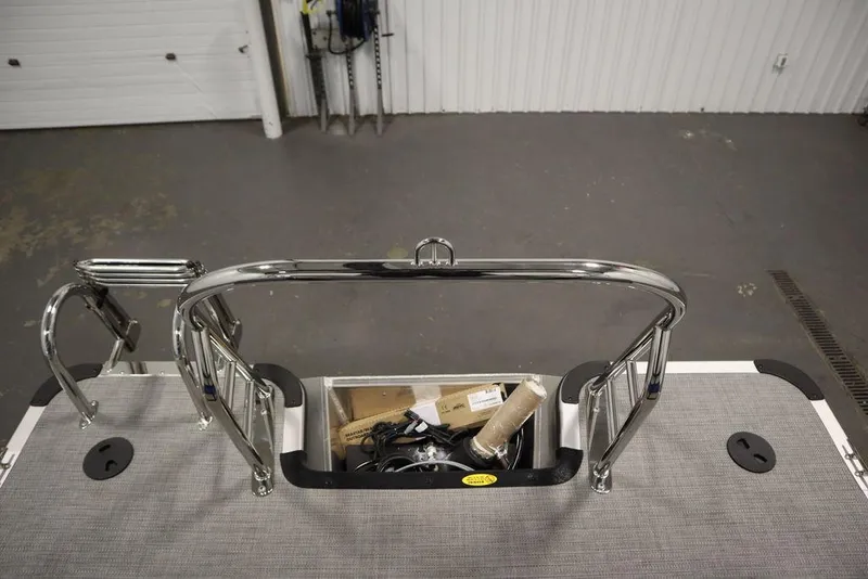 Slide: The Image of 2025 Bentley Pontoons 223 Bolt Tri-Toon rear deck with storage compartment and stainless steel rails. - 32