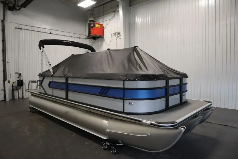Slide: The Image of 2025 Bentley Pontoons 223 Bolt Tri-Toon with cover in a storage facility. - 33