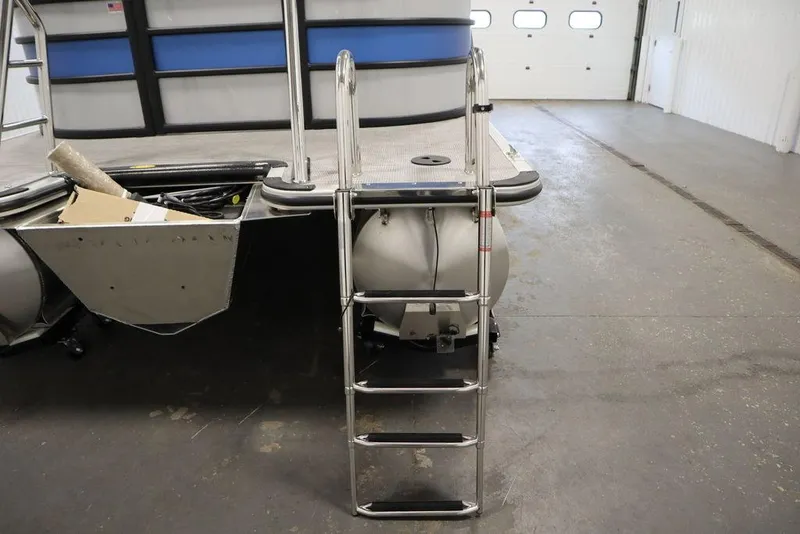 Slide: The Image of 2025 Bentley Pontoons 223 Bolt Tri-Toon with ladder in a garage setting. - 35