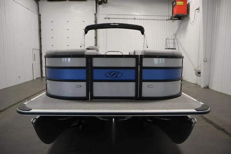Slide: The Image of 2025 Bentley Pontoons 223 Bolt Tri-Toon in a spacious indoor setting. - 4