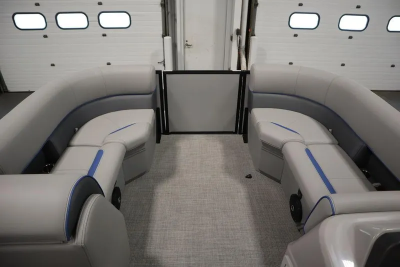 Slide: The Image of 2025 Bentley Pontoons 223 Bolt Tri-Toon interior with gray seating and blue accents. - 8