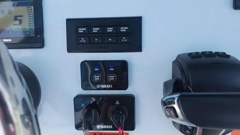 Slide: The Image of Control panel of 2023 Sea Hunt Ultra 305 SE boat with Yamaha systems. - 11