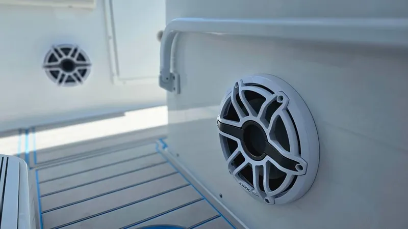 Slide: The Image of 2023 Sea Hunt Ultra 305 SE boat speakers on deck, showcasing modern marine audio system. - 17