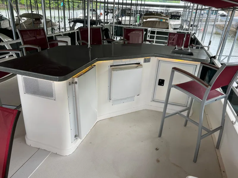 Slide: The Image of Houseboat interior with bar counter and red chairs, Fun Country 56 Forever 10, 1996 model. - 10