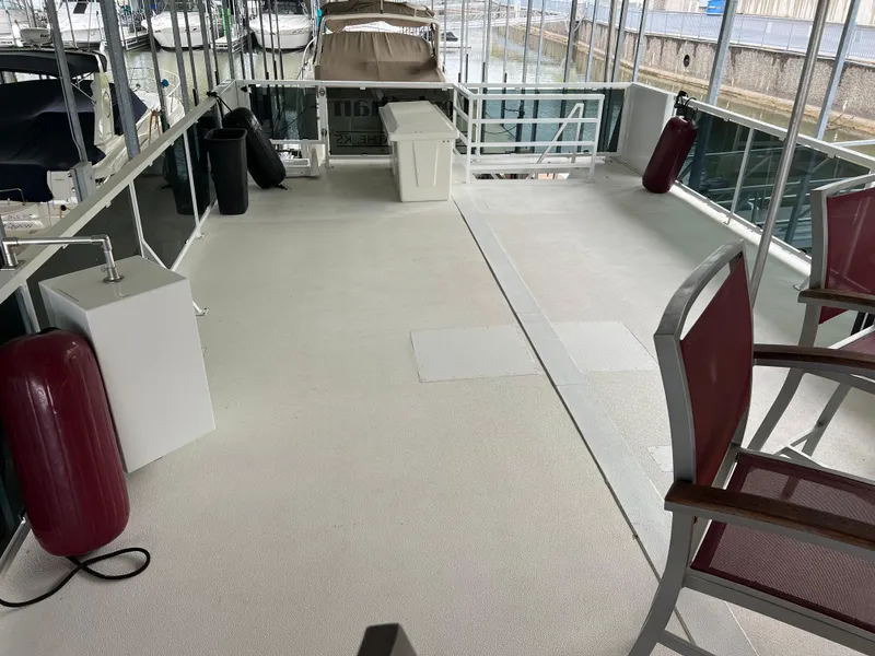 Slide: The Image of Spacious deck of 1996 Fun Country 56 Forever 10 House Boat at marina. - 11