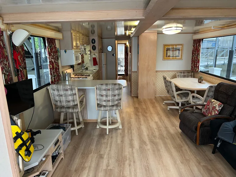 Slide: The Image of Interior of a 1996 Fun Country 56 Forever 10 House Boat with cozy furnishings. - 25