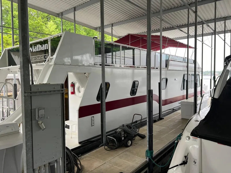 Slide: The Image of Houseboat docked in marina, Fun Country 56 Forever 10 model, 1996, with red accents. - 3