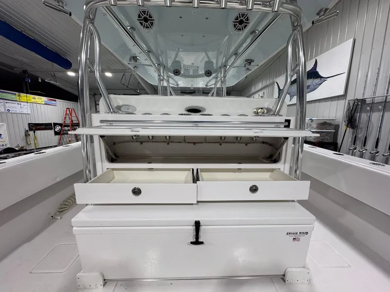Slide: The Image of 2024 Contender 44 ST boat interior with storage compartments and fishing equipment. - 23