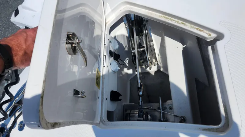 Slide: The Image of Open hatch of 2023 Pursuit S 358 Sport boat showing mechanical components. - 18