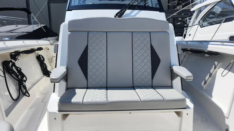 Slide: The Image of 2023 Pursuit S 358 Sport boat seat with quilted design and armrests. - 23