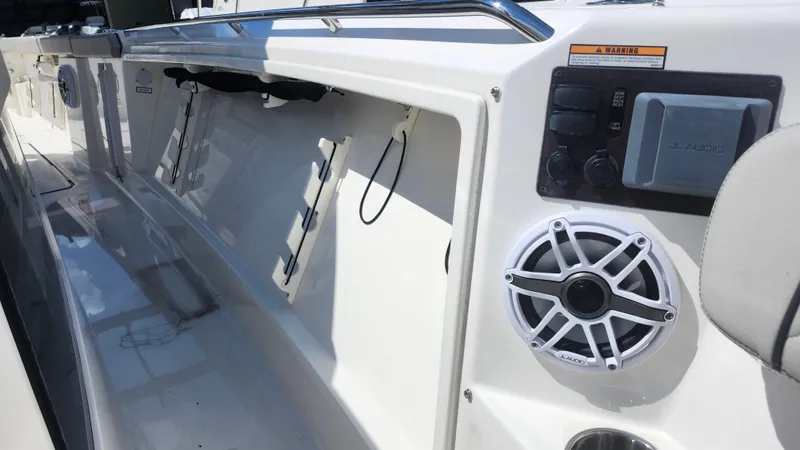 Slide: The Image of 2023 Pursuit S 358 Sport boat interior with JL Audio speaker system. - 25