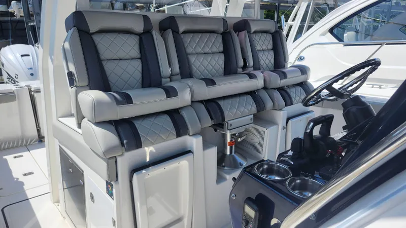 Slide: The Image of 2023 Pursuit S 358 Sport boat interior with luxurious seating and modern helm controls. - 30