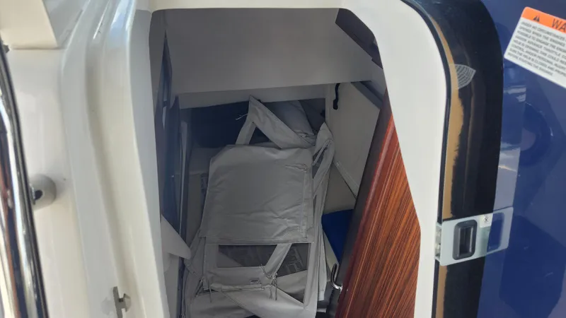 Slide: The Image of 2023 Pursuit S 358 Sport cabin interior with folded equipment. - 31