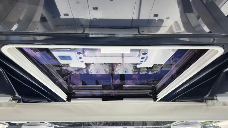 Slide: The Image of 2023 Pursuit S 358 Sport boat interior view through a sunroof. - 38