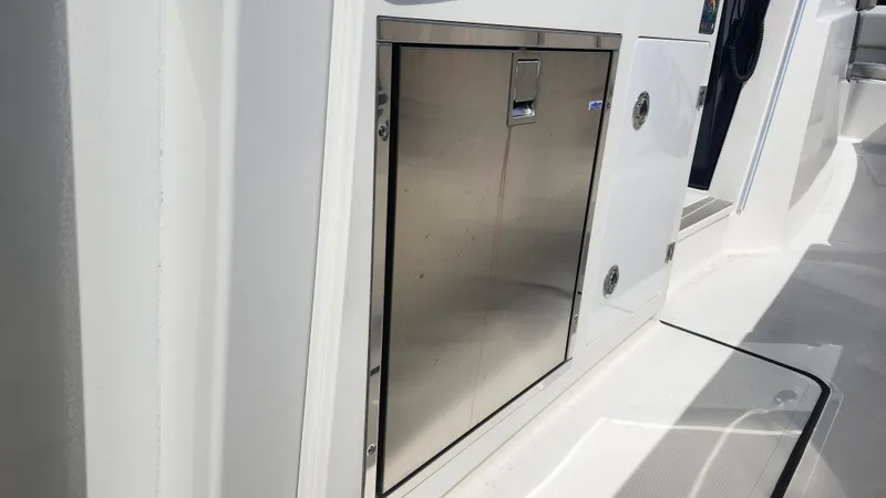 Slide: The Image of Stainless steel storage compartment on 2023 Pursuit S 358 Sport boat. - 40