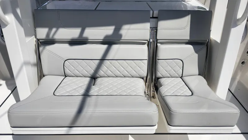 Slide: The Image of 2023 Pursuit S 358 Sport boat seating with quilted gray upholstery. - 43