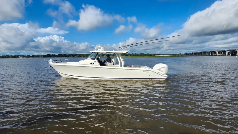 Slide: The Image of 2023 Pursuit S 358 Sport boat cruising on a sunny day with blue skies. - 8