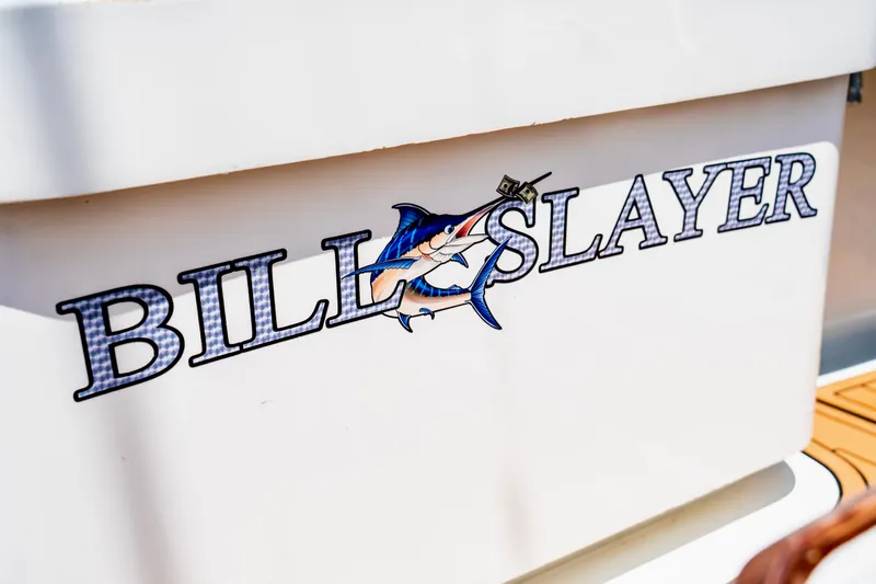 Slide: The Image of "Bill Slayer" graphic on 2002 Cabo 47 Flybridge Sportfisher boat. - 14