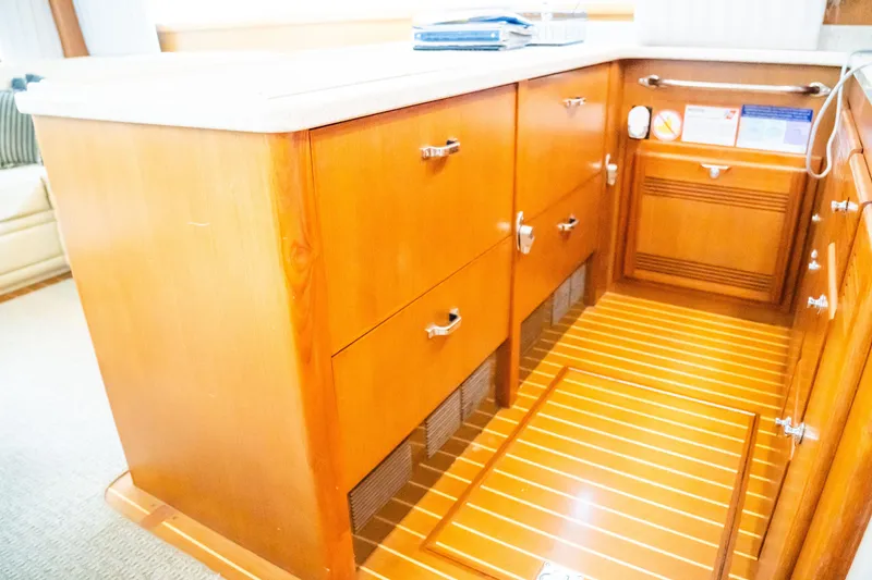 Slide: The Image of Luxurious wooden cabinetry in 2002 Cabo 47 Flybridge Sportfisher yacht interior. - 22