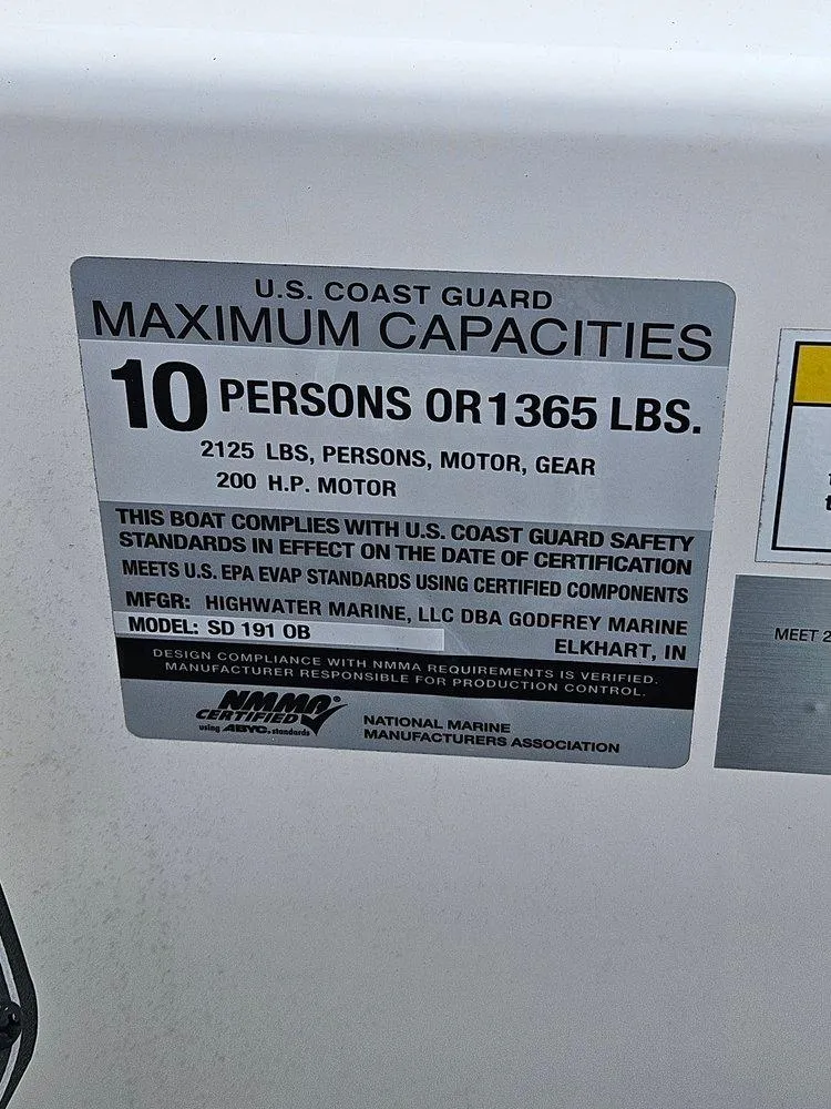 Slide: The Image of 2024 Hurricane SD 191 OB boat capacity label: 10 persons or 1365 lbs, 200 HP motor. - 12