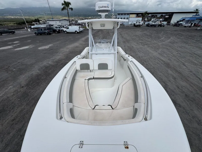 Slide: The Image of 2014 Tidewater 230 LXF boat with Garmin equipment, docked in a marina. - 11