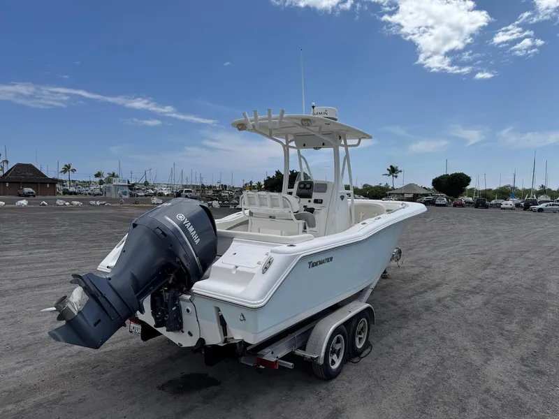 Slide: The Image of 2014 Tidewater 230 LXF boat with Yamaha engine on trailer, parked near marina. - 7