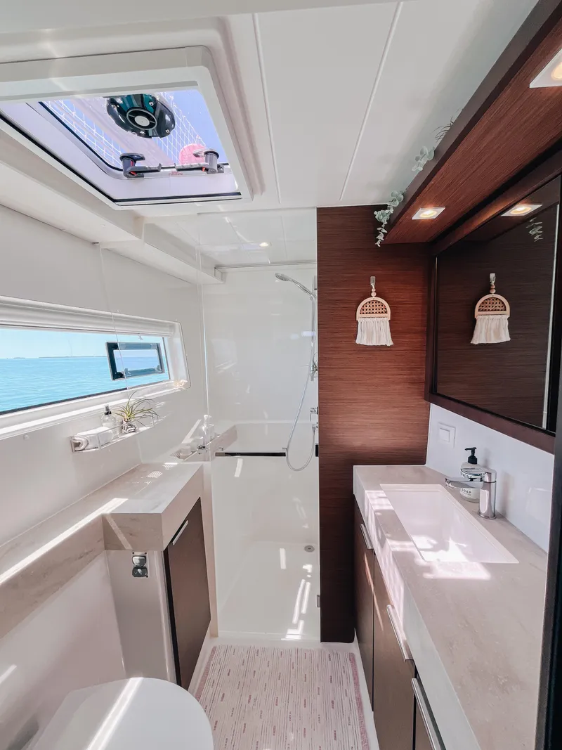 Slide: The Image of Modern bathroom interior of 2023 Lagoon 40 yacht with sleek design and ocean view. - 23