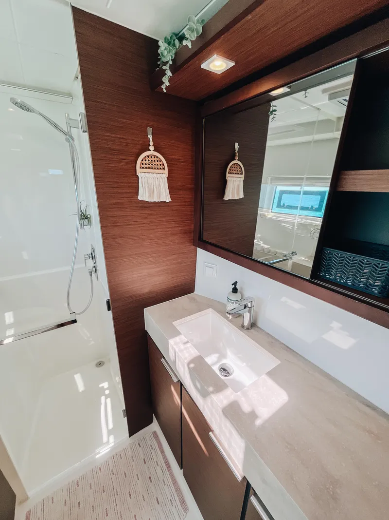 Slide: The Image of Modern bathroom interior in 2023 Lagoon 40 yacht, featuring sleek design and elegant fixtures. - 25