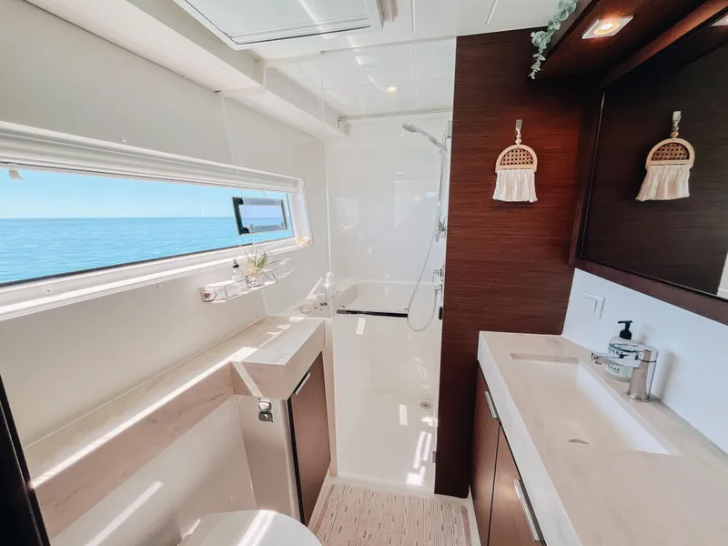 Slide: The Image of Luxurious bathroom interior of 2023 Lagoon 40 yacht with ocean view. - 31
