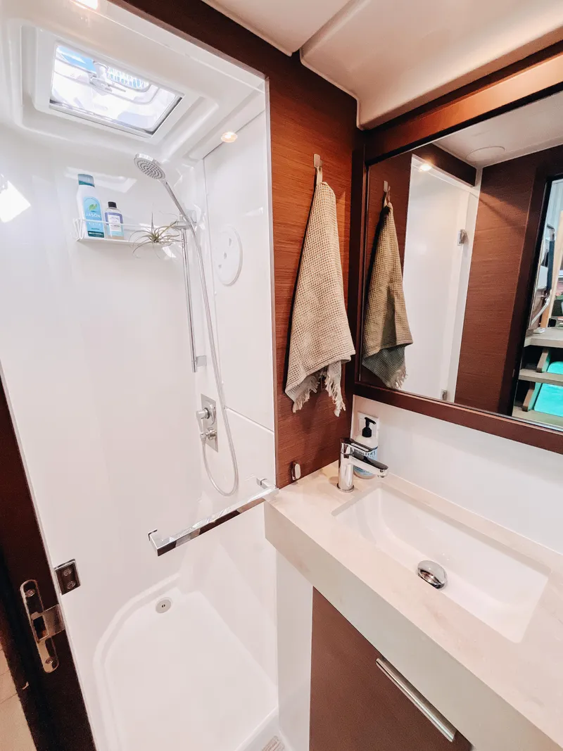 Slide: The Image of Modern bathroom in 2023 Lagoon 40 yacht with shower and sink. - 36