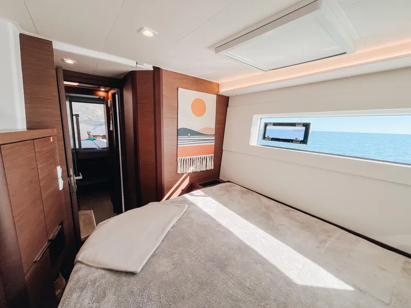 Slide: The Image of Luxurious interior of 2023 Lagoon 40 yacht with ocean view through window. - 40