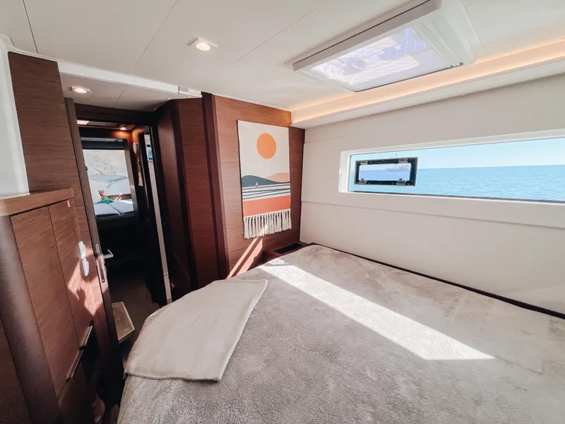 Slide: The Image of Luxurious interior of 2023 Lagoon 40 yacht with ocean view and modern decor. - 41