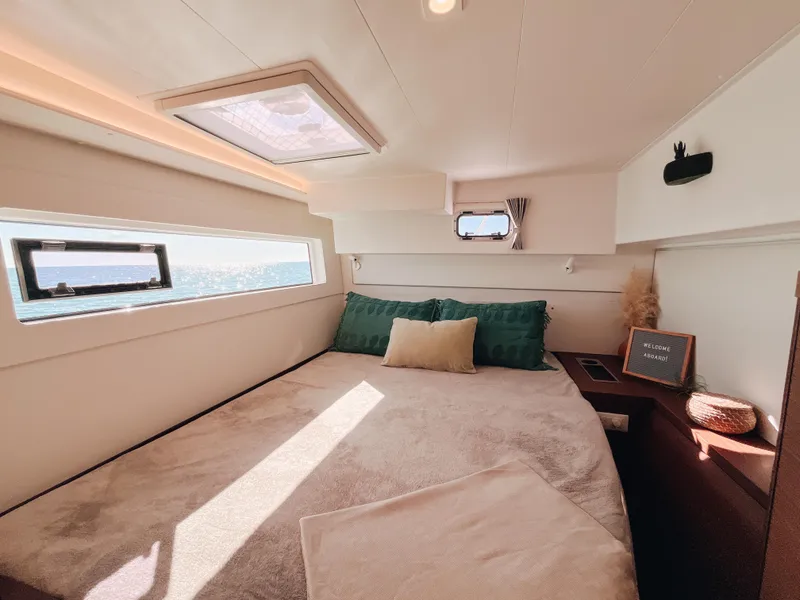 Slide: The Image of Luxurious cabin interior of 2023 Lagoon 40 catamaran with ocean view windows. - 42