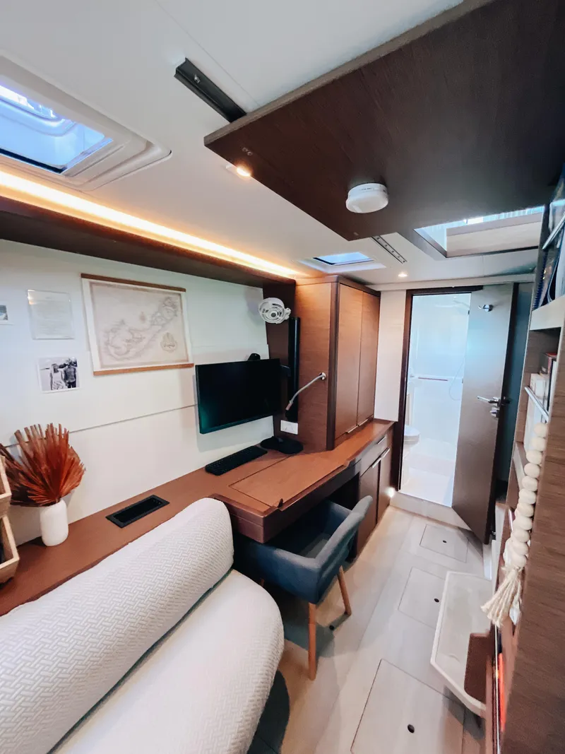 Slide: The Image of Modern interior of 2023 Lagoon 40 yacht with cozy seating and sleek design. - 45