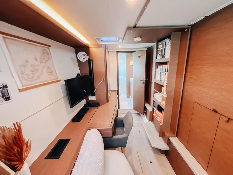 Slide: The Image of Modern interior of 2023 Lagoon 40 yacht with workspace and shelving. - 46