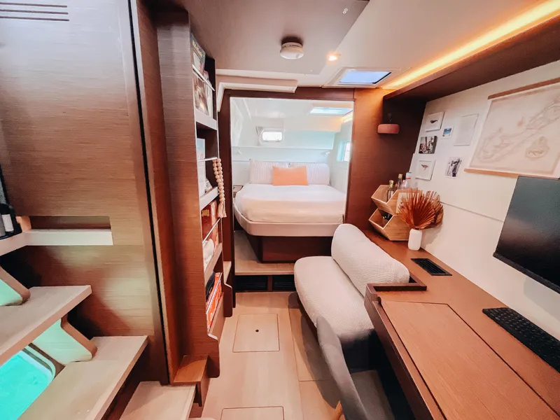 Slide: The Image of Luxurious interior of 2023 Lagoon 40 catamaran with cozy bedroom and modern workspace. - 47