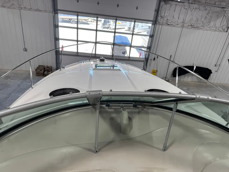 Slide: The Image of 2005 Sea Ray 300 Sundancer boat interior in a garage setting. - 11