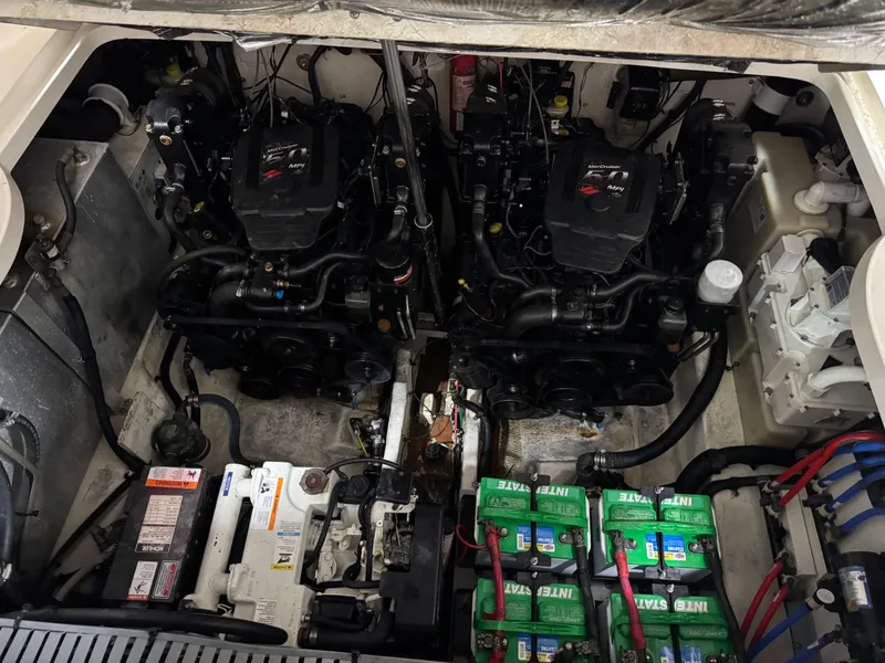 Slide: The Image of Engine compartment of a 2005 Sea Ray 300 Sundancer with dual engines and batteries. - 18