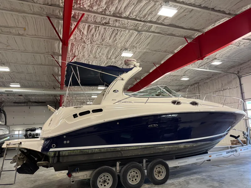 Slide: The Image of 2005 Sea Ray 300 Sundancer boat on trailer in indoor storage facility. - 3