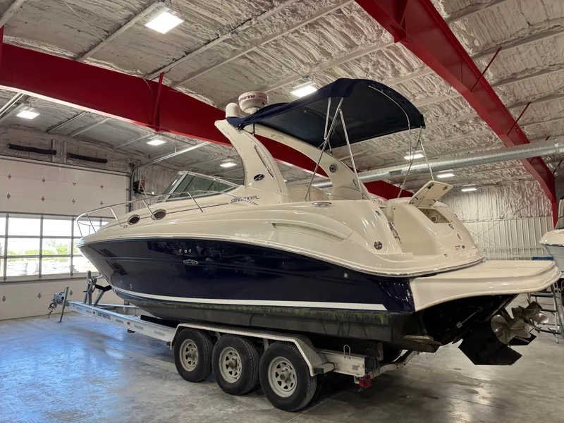 Slide: The Image of 2005 Sea Ray 300 Sundancer boat on trailer in indoor storage facility. - 4
