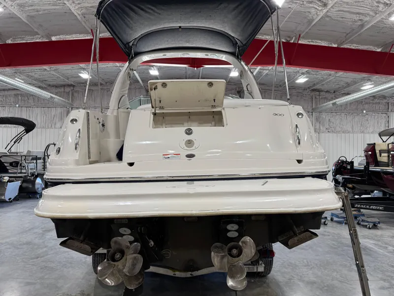 Slide: The Image of 2005 Sea Ray 300 Sundancer boat in a storage facility, rear view. - 5