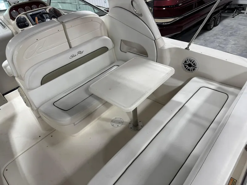 Slide: The Image of 2005 Sea Ray 300 Sundancer boat interior with seating and table. - 9