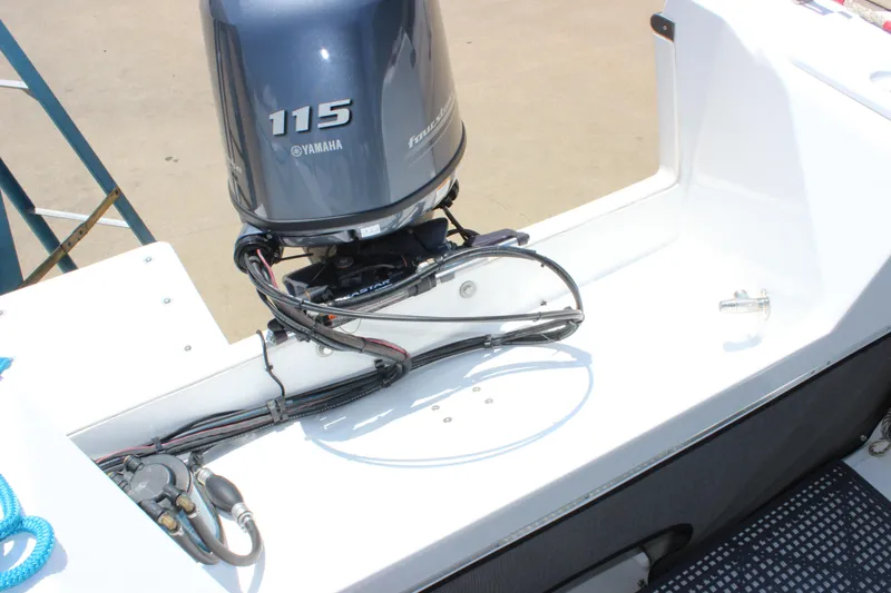 Slide: The Image of 2023 C-Dory 22' Cruiser with Yamaha 115 outboard motor, rear deck view. - 11