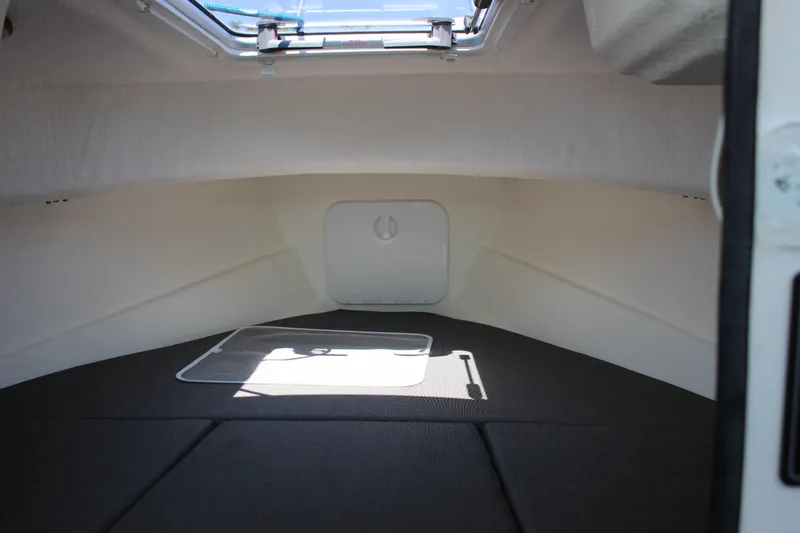Slide: The Image of Interior cabin of 2023 C-Dory 22' Cruiser with hatch and seating area. - 16