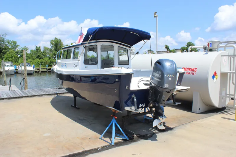 Slide: The Image of 2023 C-Dory 22' Cruiser boat with Yamaha 115 engine at dockside. - 5